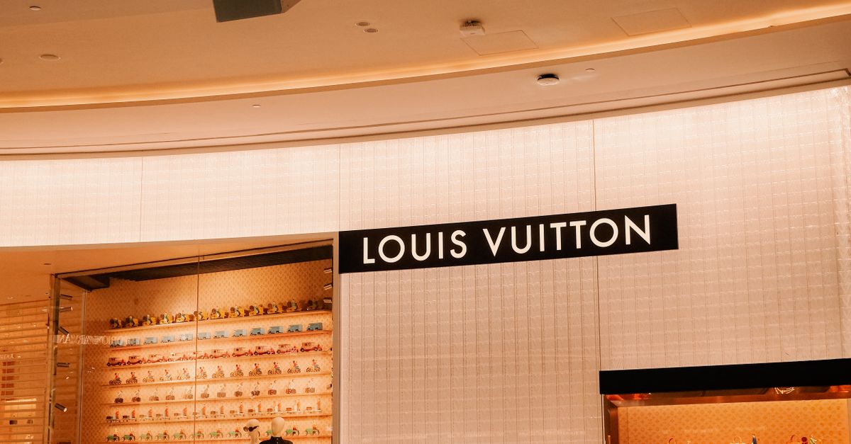 Louis Vuitton storefront in warm interior light